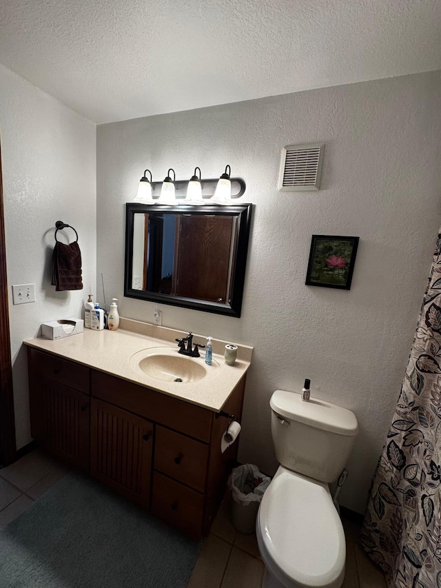 full bathroom with tile patterned floors, visible vents, and a textured wall