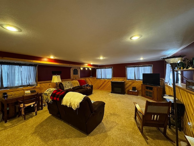 interior space with recessed lighting, wainscoting, wood walls, and a textured ceiling