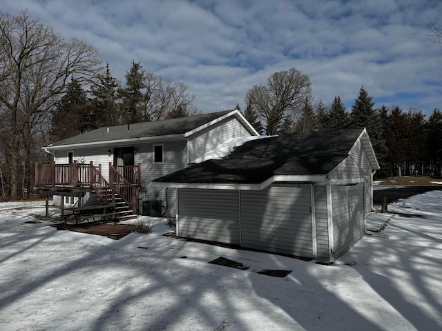 view of front of house with cooling unit and a wooden deck