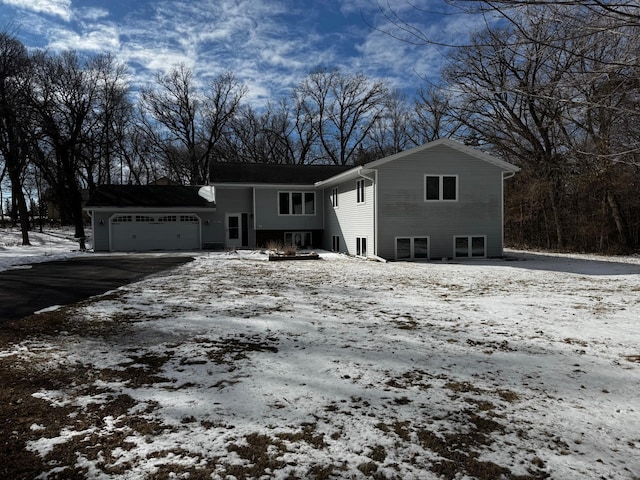 view of front of property with driveway and an attached garage