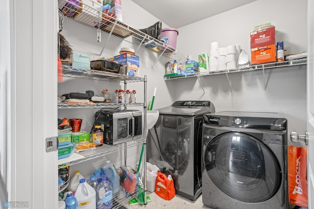 clothes washing area featuring laundry area and washing machine and dryer