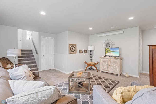 living area featuring baseboards, stairway, carpet, and recessed lighting