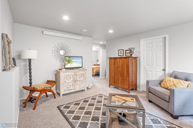 living room with baseboards, recessed lighting, and light colored carpet