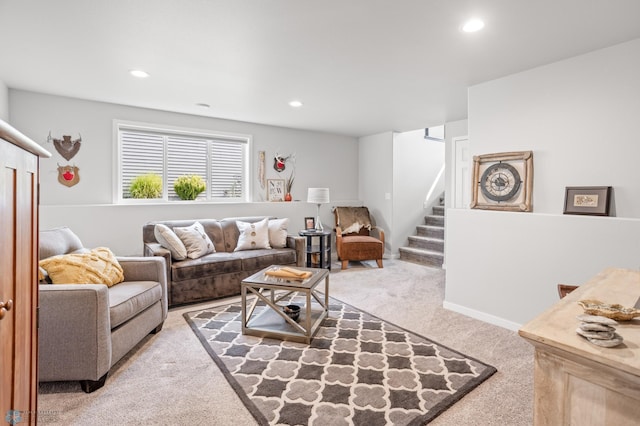 carpeted living room with stairs, baseboards, and recessed lighting