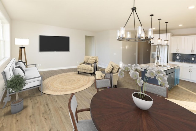 dining area featuring recessed lighting, an inviting chandelier, baseboards, and wood finished floors