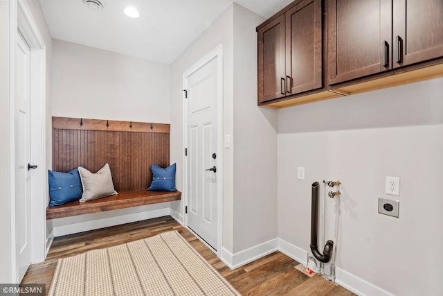 mudroom featuring baseboards and light wood finished floors