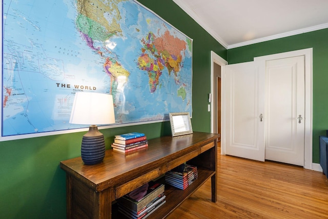 office area featuring crown molding and wood finished floors