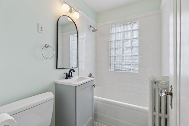 bathroom featuring vanity, bathtub / shower combination, and toilet