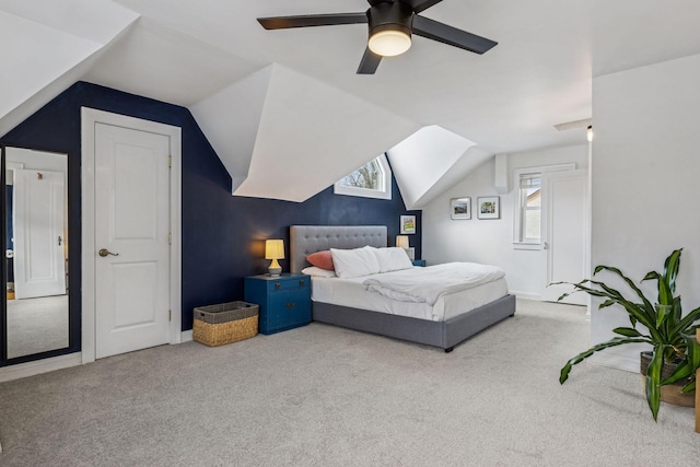 bedroom featuring vaulted ceiling, carpet floors, and a ceiling fan