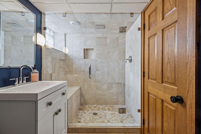 bathroom with a stall shower and vanity