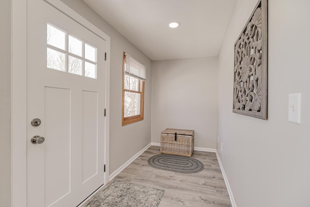 entryway featuring recessed lighting, wood finished floors, and baseboards