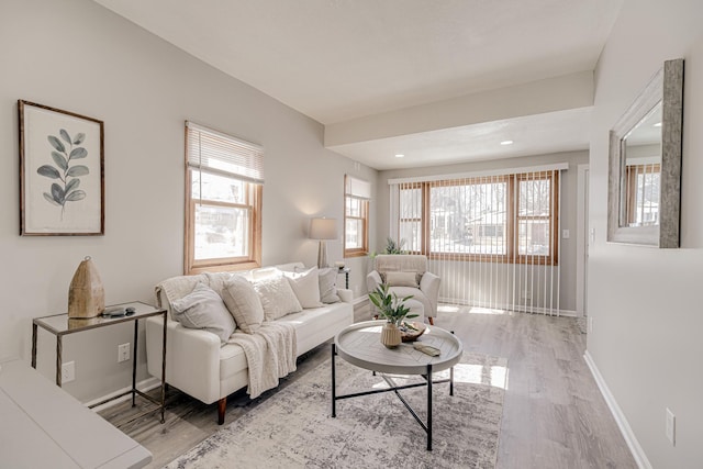 living room featuring light wood-style flooring and baseboards