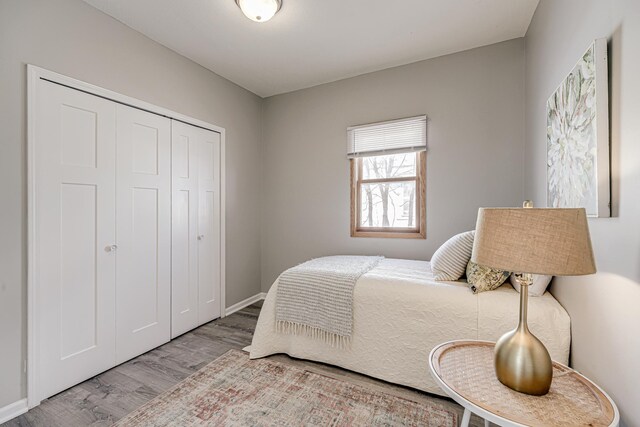 bedroom featuring a closet and wood finished floors