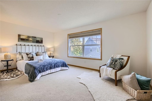 carpeted bedroom with baseboards