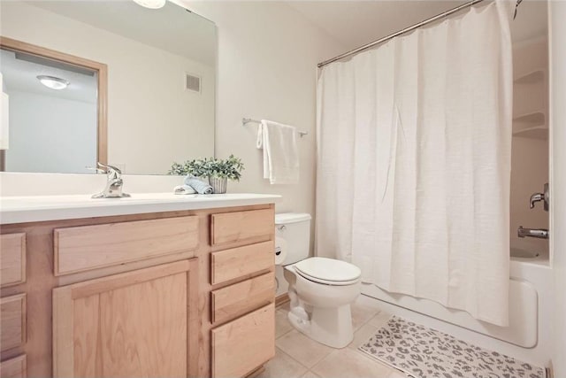 full bathroom with shower / tub combo with curtain, visible vents, toilet, vanity, and tile patterned floors