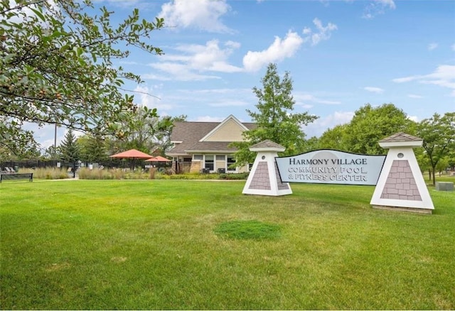 view of home's community with a lawn