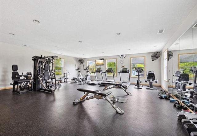 workout area with visible vents and baseboards