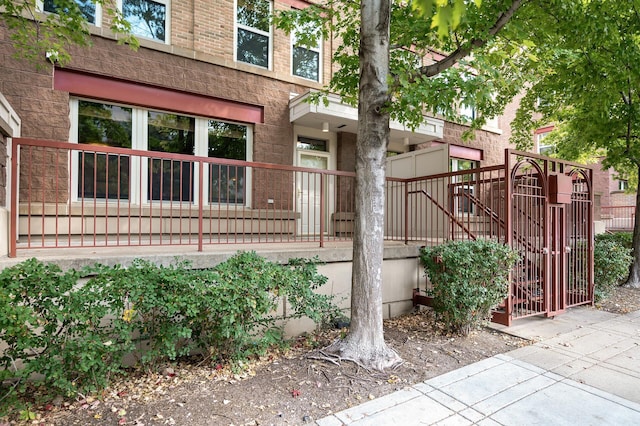 exterior space featuring brick siding