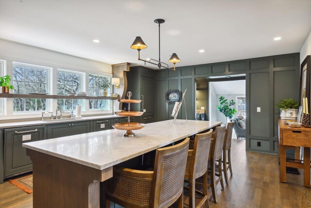 10 Saint Albans Rd E, Hopkins, MN 55305 - kitchen featuring a sink, gray cabinetry, light stone countertops, dark wood finished floors, and recessed lighting