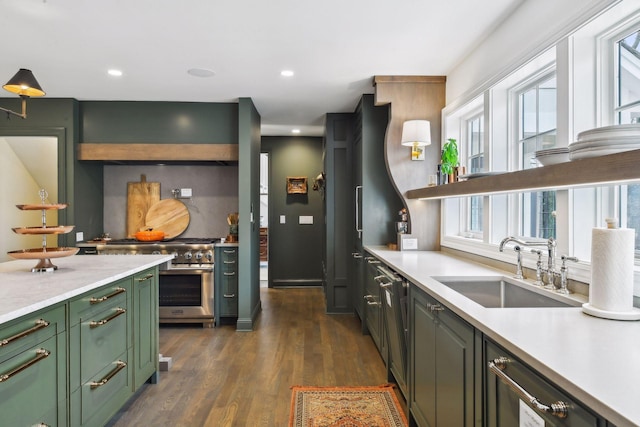 10 Saint Albans Rd E, Hopkins, MN 55305 - kitchen with green cabinets, a sink, high end stove, light countertops, and recessed lighting