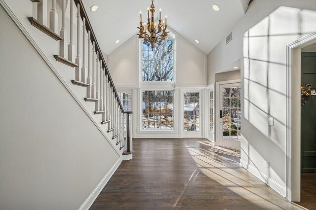 10 Saint Albans Rd E, Hopkins, MN 55305 - foyer featuring a chandelier, plenty of natural light, high vaulted ceiling, wood finished floors, and stairs