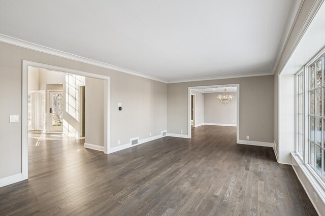10 Saint Albans Rd E, Hopkins, MN 55305 - empty room with a chandelier, baseboards, dark wood finished floors, and crown molding