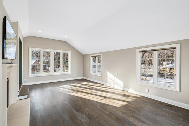 10 Saint Albans Rd E, Hopkins, MN 55305 - unfurnished living room with vaulted ceiling, baseboards, wood finished floors, recessed lighting, and a fireplace