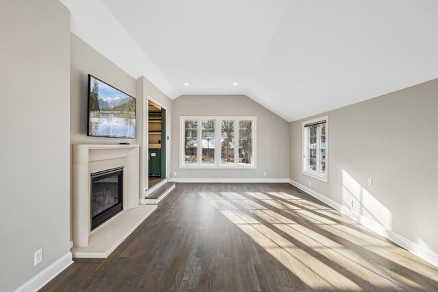 10 Saint Albans Rd E, Hopkins, MN 55305 - unfurnished living room with a glass covered fireplace, lofted ceiling, baseboards, wood finished floors, and recessed lighting