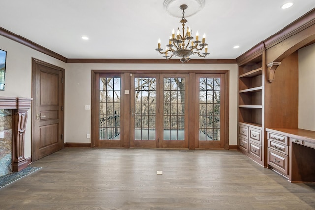 10 Saint Albans Rd E, Hopkins, MN 55305 - unfurnished dining area featuring wood finished floors, healthy amount of natural light, baseboards, crown molding, and recessed lighting