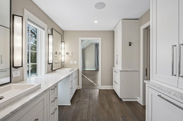 10 Saint Albans Rd E, Hopkins, MN 55305 - bathroom with wood finished floors, vanity, baseboards, and recessed lighting