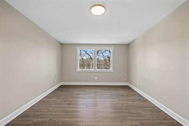 10 Saint Albans Rd E, Hopkins, MN 55305 - empty room featuring dark wood-style flooring and baseboards