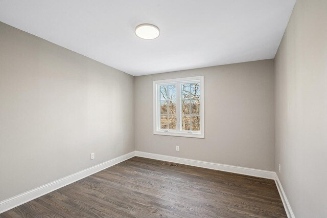 10 Saint Albans Rd E, Hopkins, MN 55305 - spare room featuring dark wood-type flooring and baseboards