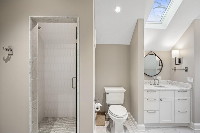 10 Saint Albans Rd E, Hopkins, MN 55305 - bathroom featuring a skylight, a shower stall, toilet, vanity, and baseboards