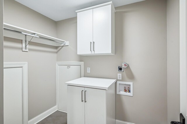 10 Saint Albans Rd E, Hopkins, MN 55305 - laundry area featuring hookup for an electric dryer, baseboards, washer hookup, and cabinet space