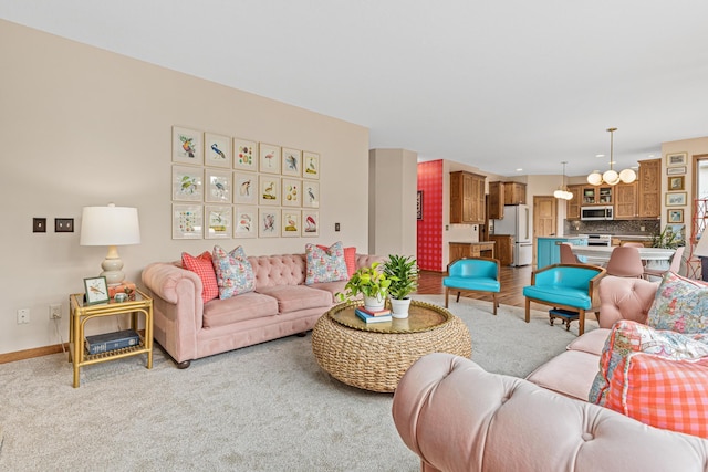 living area featuring baseboards and light colored carpet