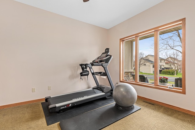 workout room with carpet floors and baseboards