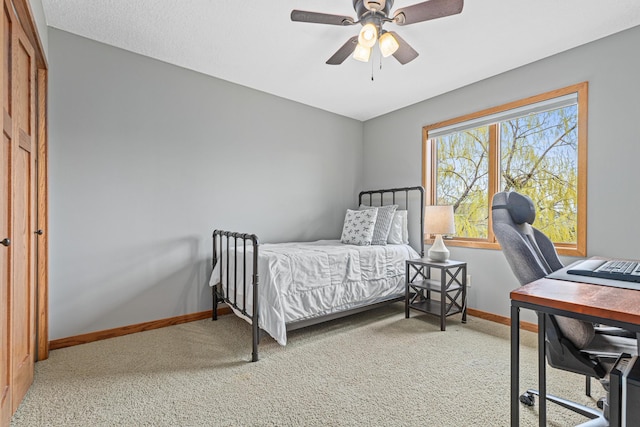 bedroom with carpet floors, baseboards, and ceiling fan