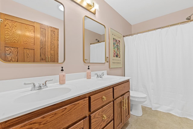 full bathroom featuring a sink, toilet, double vanity, and a shower with shower curtain