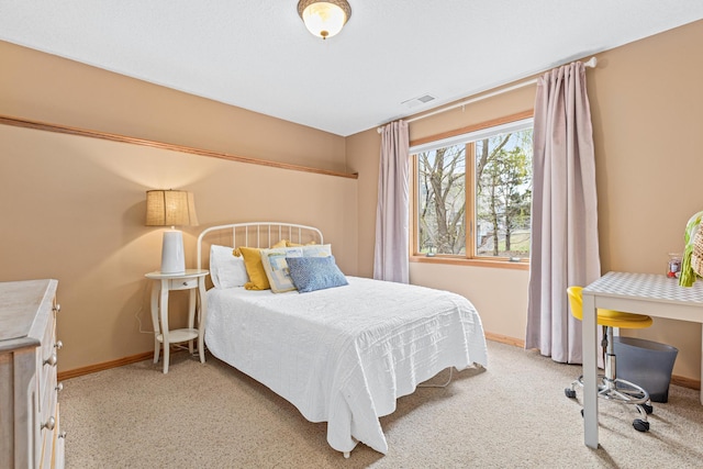 carpeted bedroom featuring visible vents and baseboards