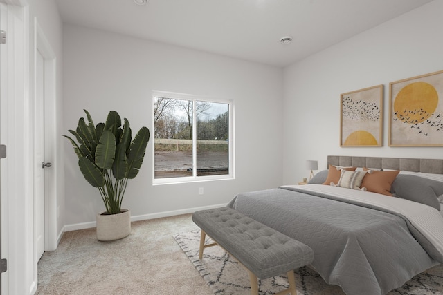 bedroom featuring carpet flooring and baseboards