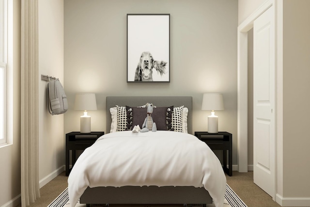 bedroom featuring baseboards and carpet floors