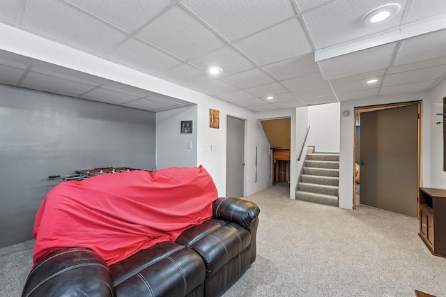 interior space with recessed lighting, a drop ceiling, and stairs