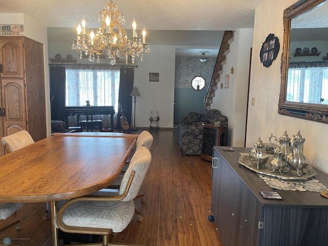 dining room with stairs, dark wood-style flooring, and a textured ceiling