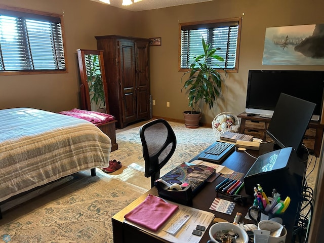 bedroom featuring baseboards