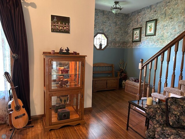 stairs with a wealth of natural light, baseboards, and wood finished floors