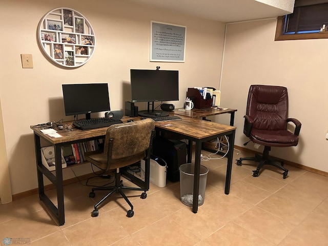 office space with tile patterned floors and baseboards