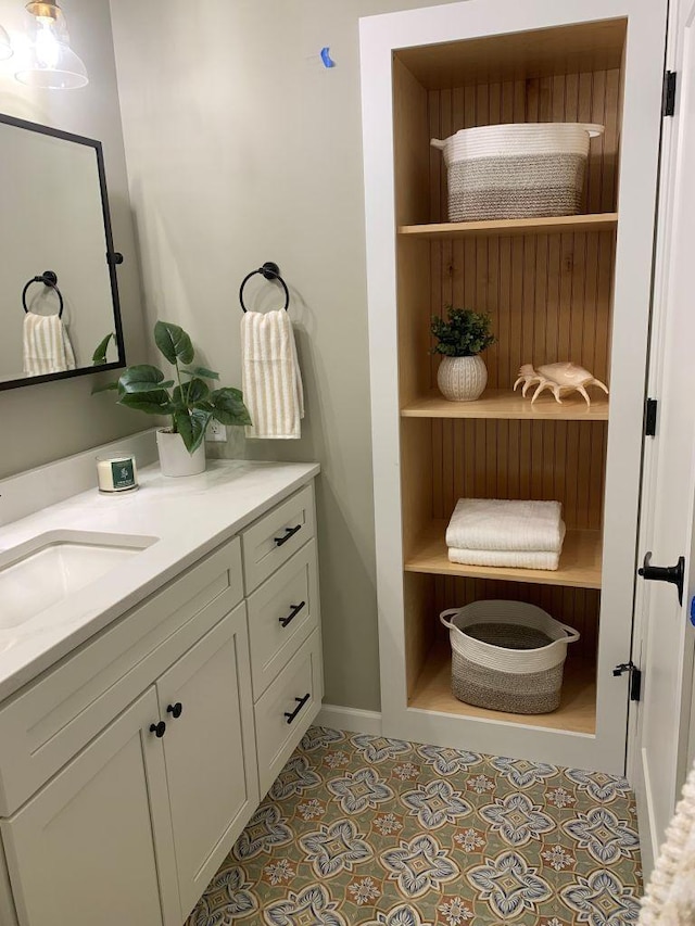 bathroom with tile patterned flooring and vanity