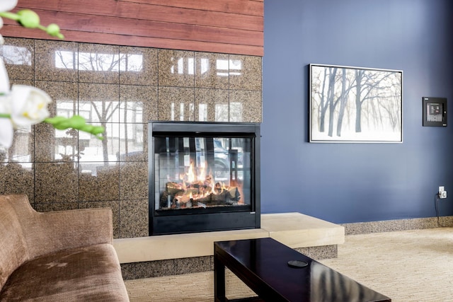 interior details featuring a glass covered fireplace