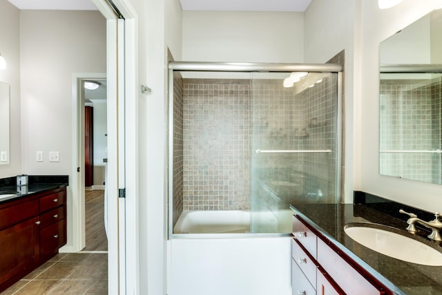 bathroom with vanity and an enclosed shower