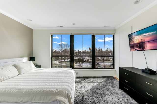 bedroom featuring visible vents and ornamental molding